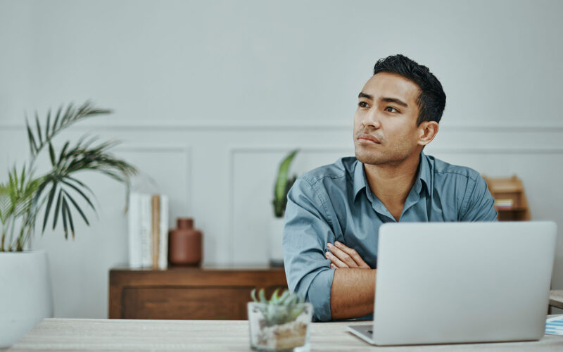 young man pondering his self improvement opportunities